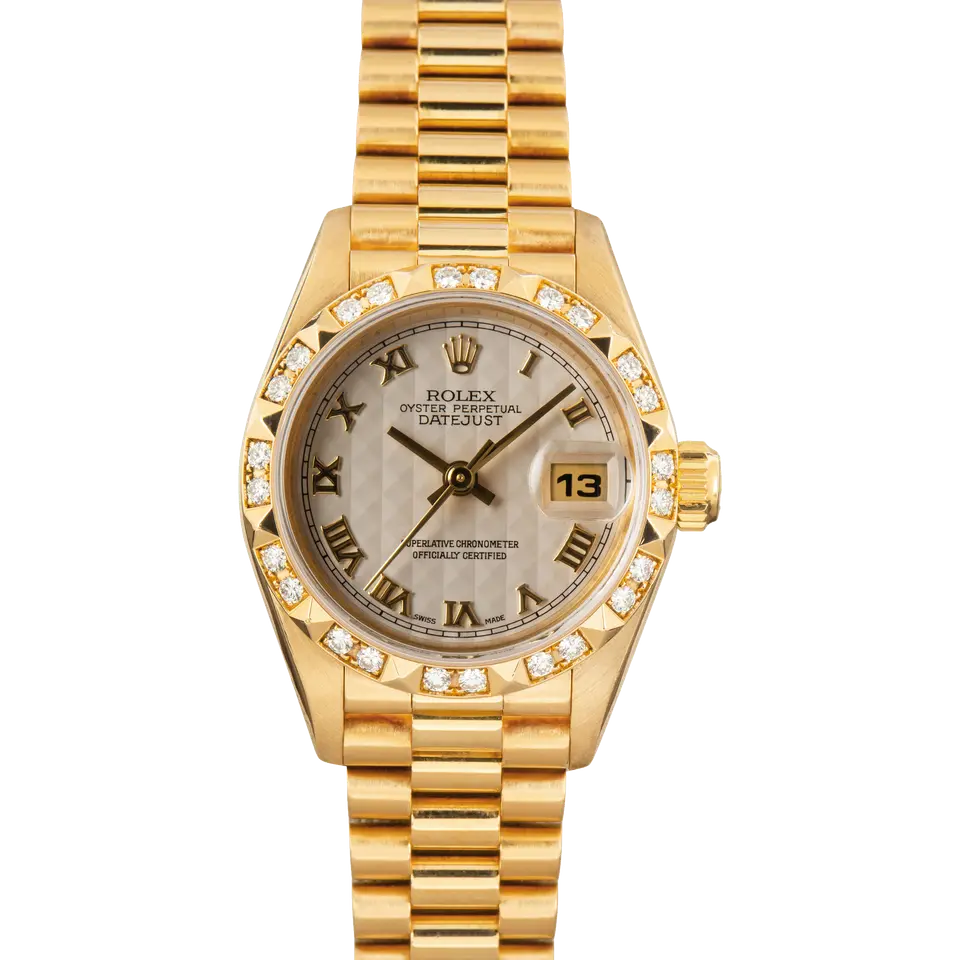 Rolex Lady-Datejust 69258 with a silver pyramid Roman-numeral dial, pyramid diamond-set bezel and yellow gold President bracelet, a pre-owned example, front view of the whole watch