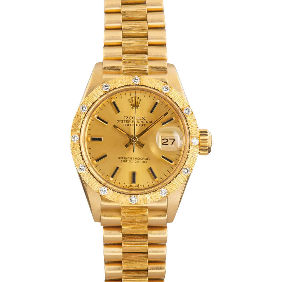Rolex Lady-Datejust 6927 with a champagne dial with baton markers and a bark-finish yellow gold bezel set with diamonds on a bark-finish yellow gold bracelet, a pre-owned example, front view of the whole watch