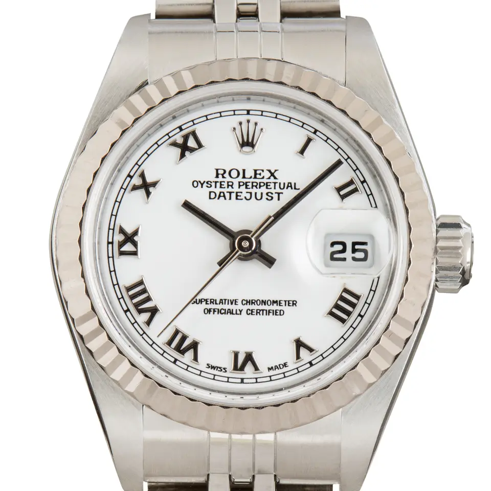 Rolex Lady-Datejust 79174 with a white dial with Roman numerals and fluted white gold bezel on a steel Jubilee bracelet, a pre-owned example, studio close-up of the case