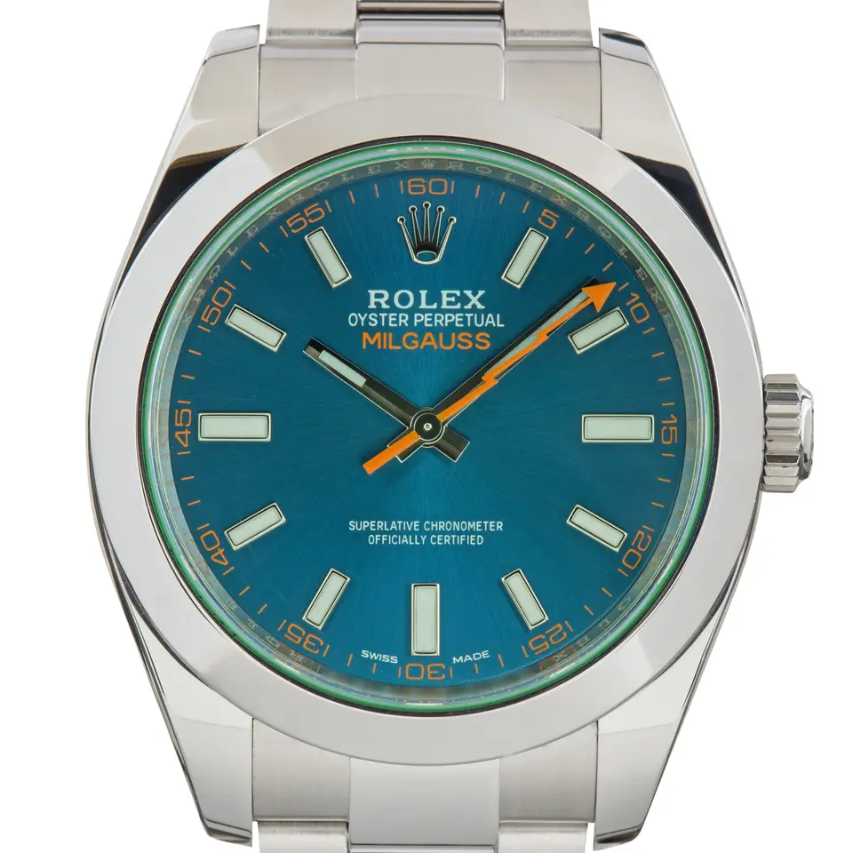 Rolex Milgauss 116400GV with a Z-Blue dial with an orange lightning-bolt seconds hand under a green crystal, smooth steel bezel and Oyster bracelet, a pre-owned example, studio close-up of the case