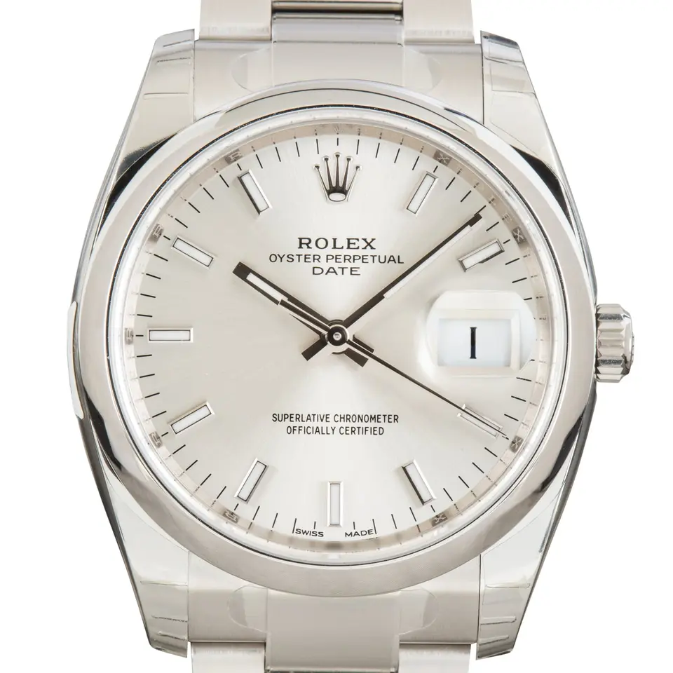 Rolex Oyster Perpetual Date 34 115200 with a silver dial with date window and smooth steel bezel on an Oyster bracelet, a pre-owned example, studio close-up of the case