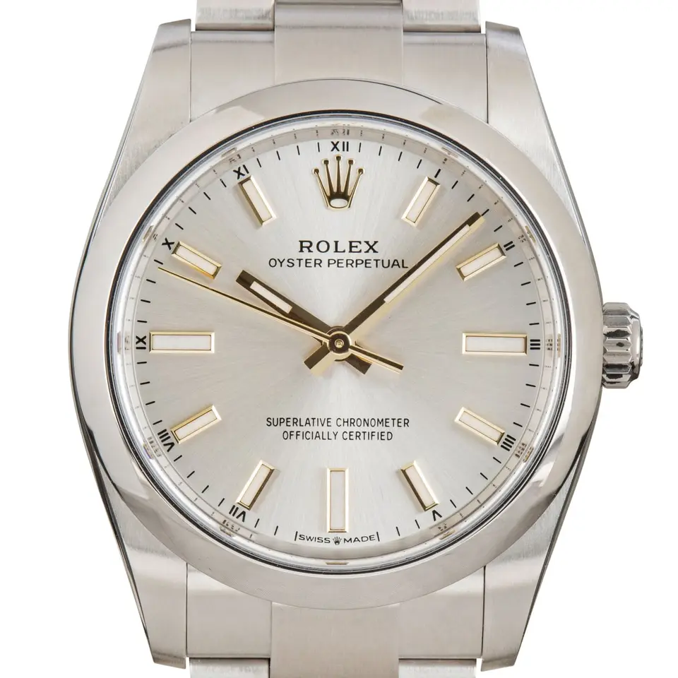 Rolex Oyster Perpetual 34 124200 with a silver dial and a smooth steel bezel, a pre-owned example, studio close-up of the case
