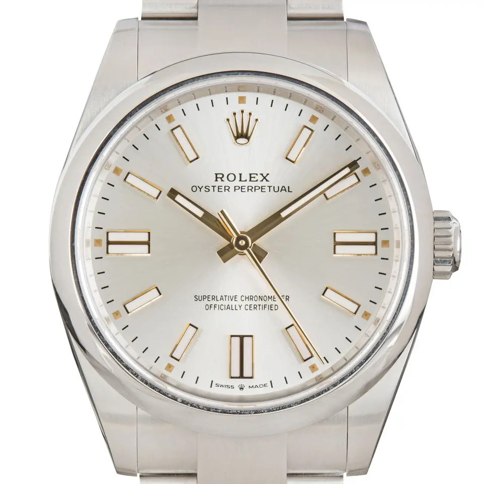 Rolex Oyster Perpetual 41 134300 with a silver dial and a smooth steel bezel, a pre-owned example, studio close-up of the case