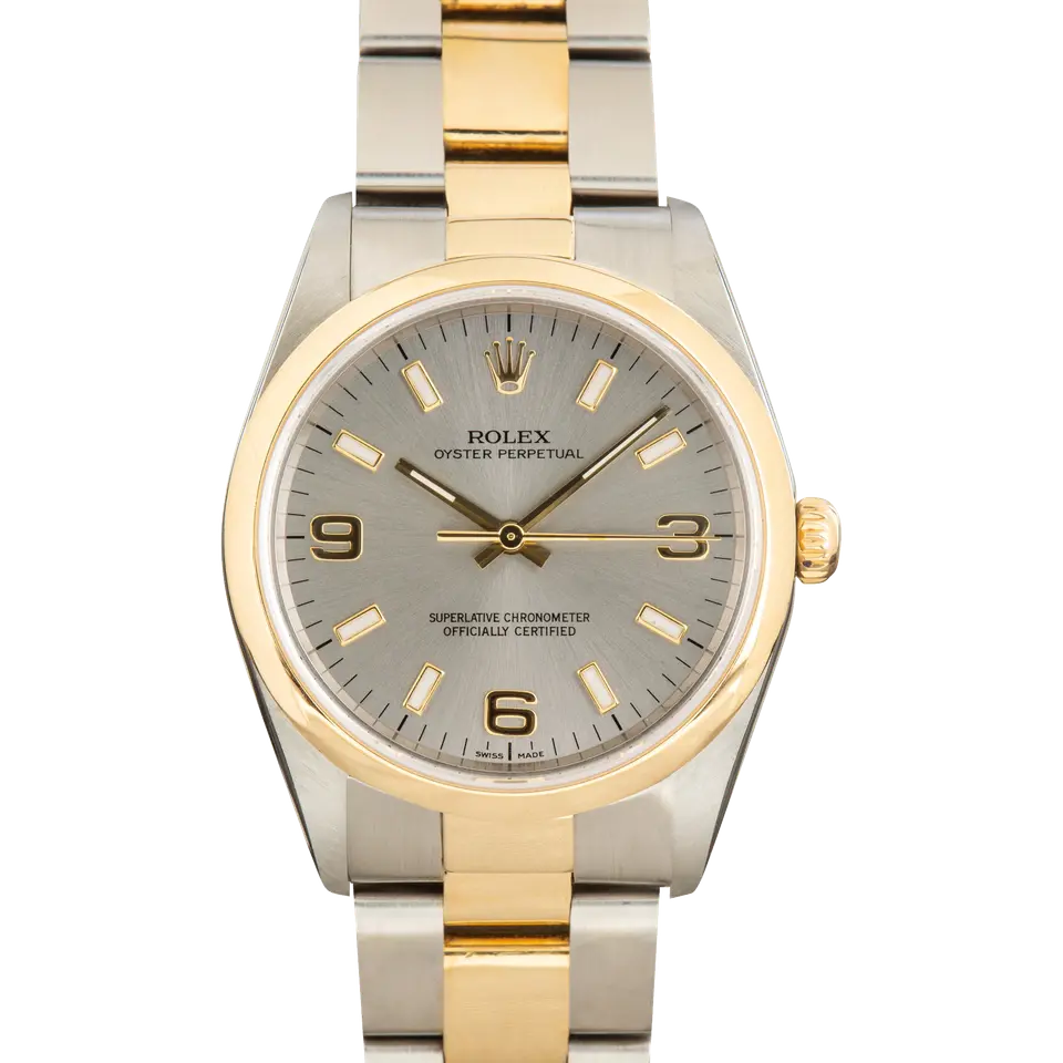 Rolex Oyster Perpetual 34 14203 with a grey dial with 3, 6 and 9 numerals, smooth yellow gold bezel and steel and gold Oyster bracelet, a pre-owned example, front view of the whole watch