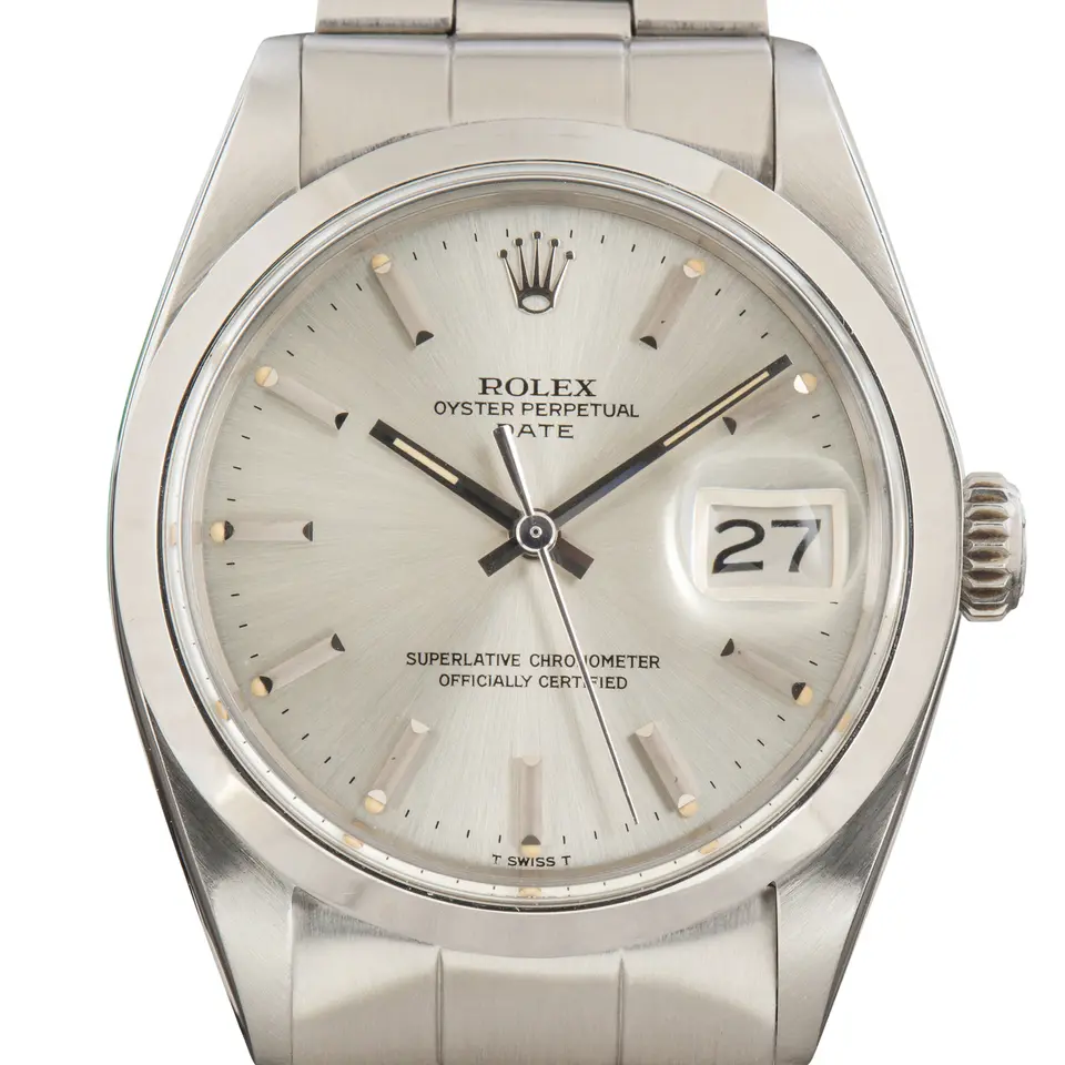 Rolex Oyster Perpetual Date 34 1500 with a silver dial with date window and smooth steel bezel on an Oyster bracelet, a pre-owned example, studio close-up of the case