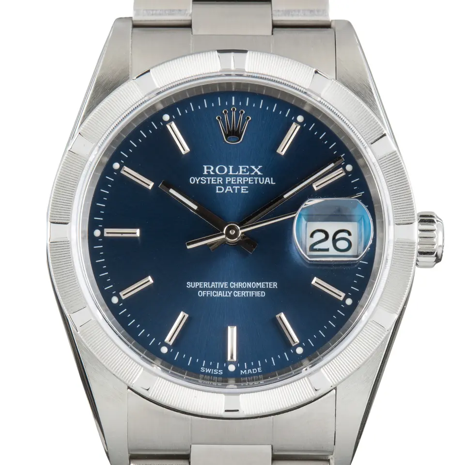 Rolex Oyster Perpetual Date 34 15210 with a blue dial with date window and engine-turned steel bezel on an Oyster bracelet, a pre-owned example, studio close-up of the case