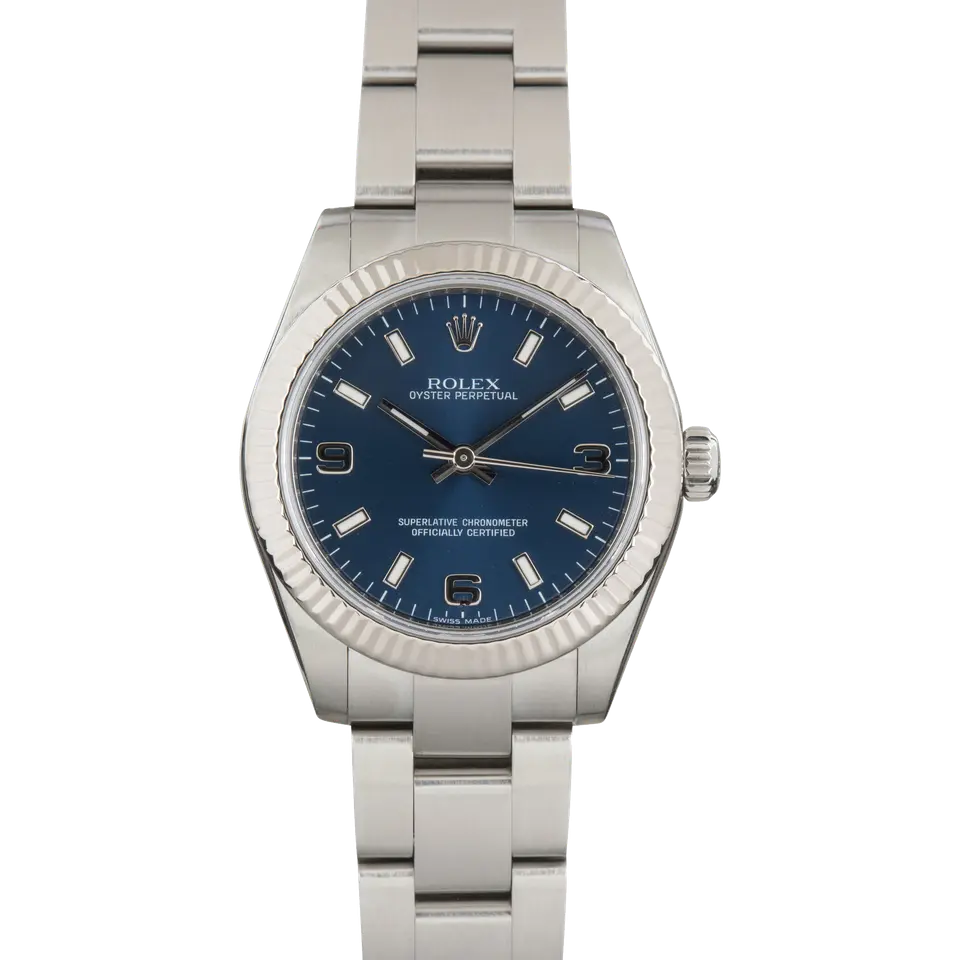 Rolex Oyster Perpetual 31 177234 with a blue dial and fluted white gold bezel on a steel Oyster bracelet, a pre-owned example, front view of the whole watch