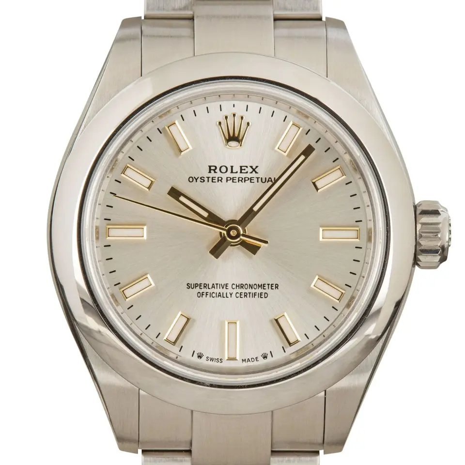 Rolex Oyster Perpetual 28 276200 with a silver dial and a smooth steel bezel, a pre-owned example, studio close-up of the case
