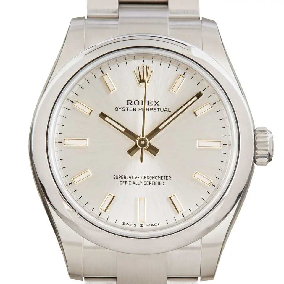 Rolex Oyster Perpetual 31 277200 with a silver dial and a smooth steel bezel, a pre-owned example, studio close-up of the case