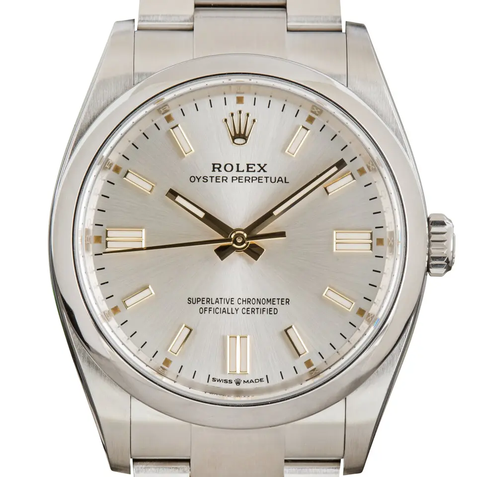 Rolex Oyster Perpetual 36 126000 with a silver dial and a smooth steel bezel, a pre-owned example, studio close-up of the case