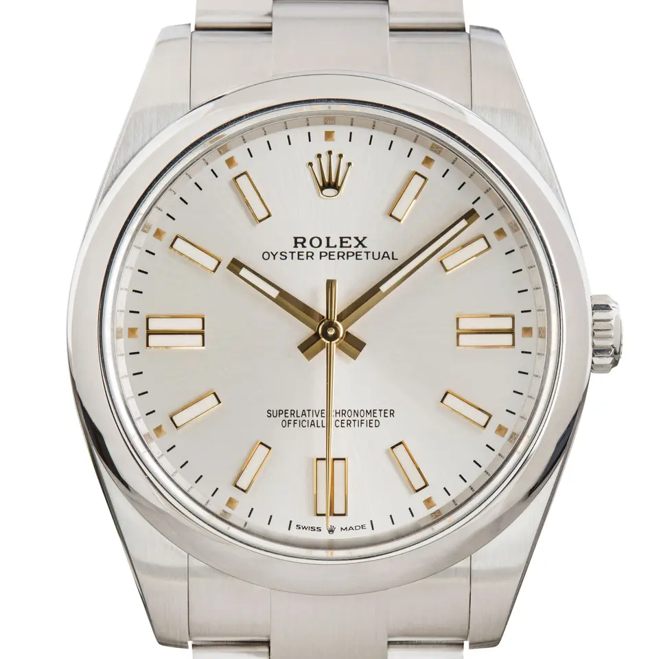 Rolex Oyster Perpetual 41 124300 with a silver dial and a smooth steel bezel, a pre-owned example, studio close-up of the case