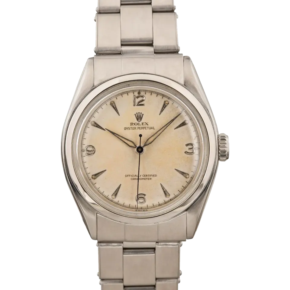 Rolex Oyster Perpetual 34 6084 with a cream dial with 3, 6, 9 and 12 numerals, smooth steel bezel and steel Oyster bracelet, a pre-owned example, front view of the whole watch