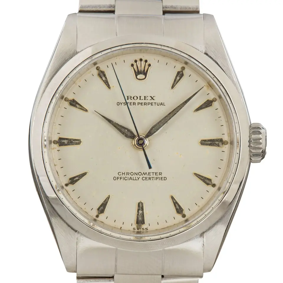 Rolex Oyster Perpetual 34 6284 with a silver dial with arrow markers, smooth steel bezel and steel Oyster bracelet, a pre-owned example, studio close-up of the case