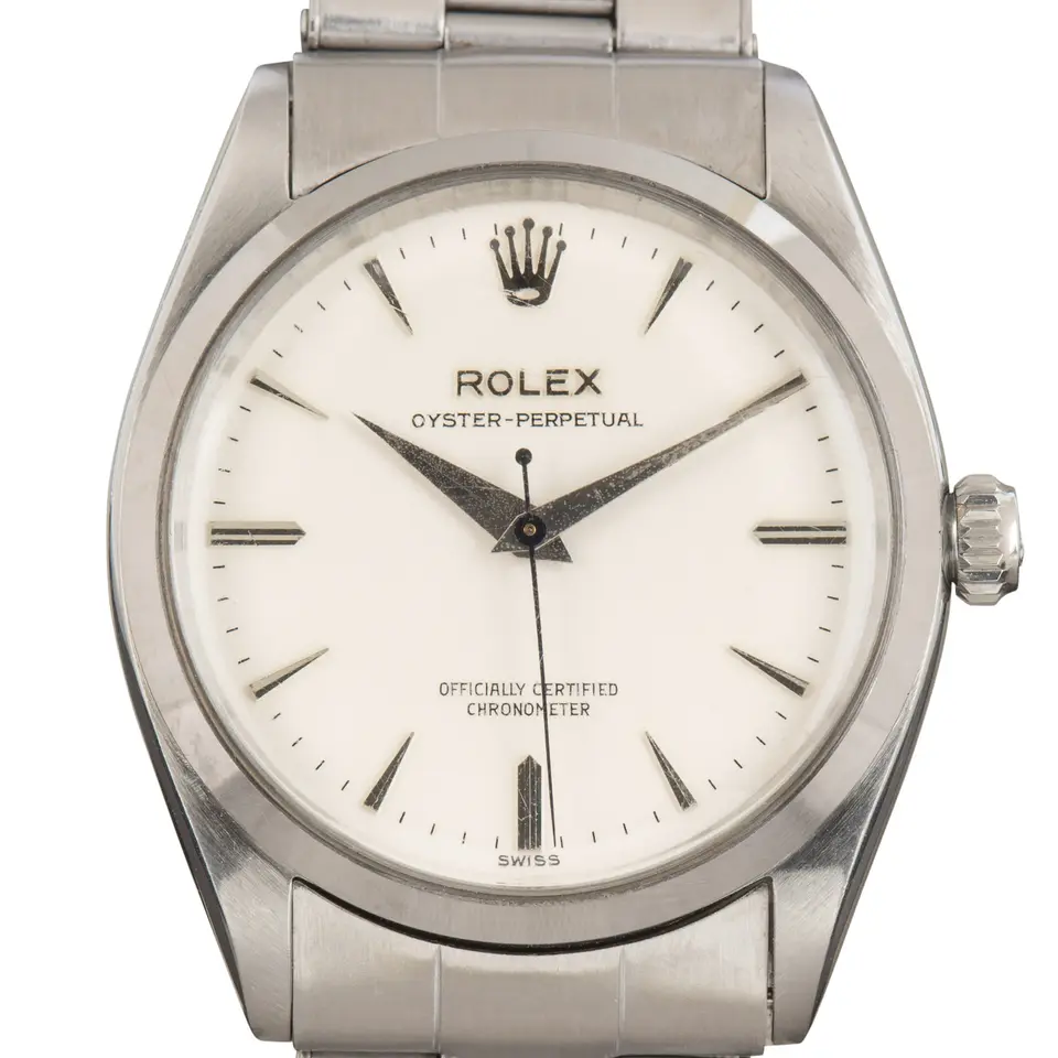 Rolex Oyster Perpetual 34 6564 with a white dial, smooth steel bezel and steel Oyster bracelet, a pre-owned example, studio close-up of the case