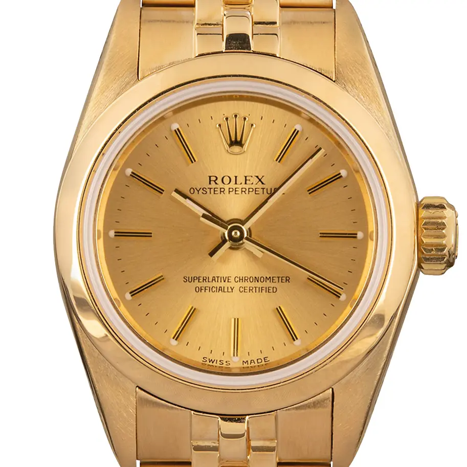 Rolex Ladies Oyster Perpetual 67188 with a champagne dial, smooth yellow gold bezel and yellow gold Jubilee bracelet, a pre-owned example, studio close-up of the case