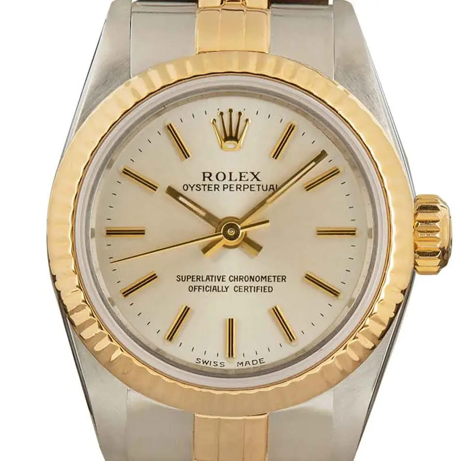 Rolex Oyster Perpetual 26 67193 with a silver dial and polished yellow gold bezel in steel and yellow gold on a Jubilee bracelet, a pre-owned example, studio close-up of the case