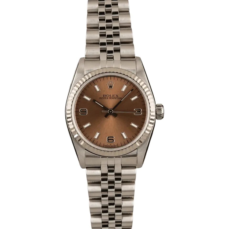 Rolex Oyster Perpetual 31 67514 with a brown dial with 3, 6 and 9 numerals, fluted white gold bezel and steel Jubilee bracelet, a pre-owned example, front view of the whole watch