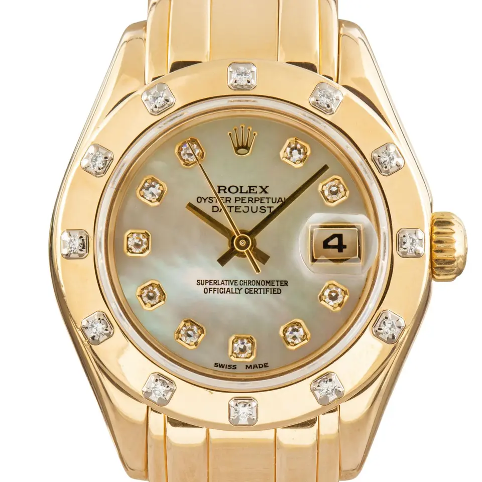 Rolex Pearlmaster 29 69318 with a mother-of-pearl dial with diamond hour markers, gem-set yellow gold bezel and yellow gold Pearlmaster bracelet, a pre-owned example, studio close-up of the case