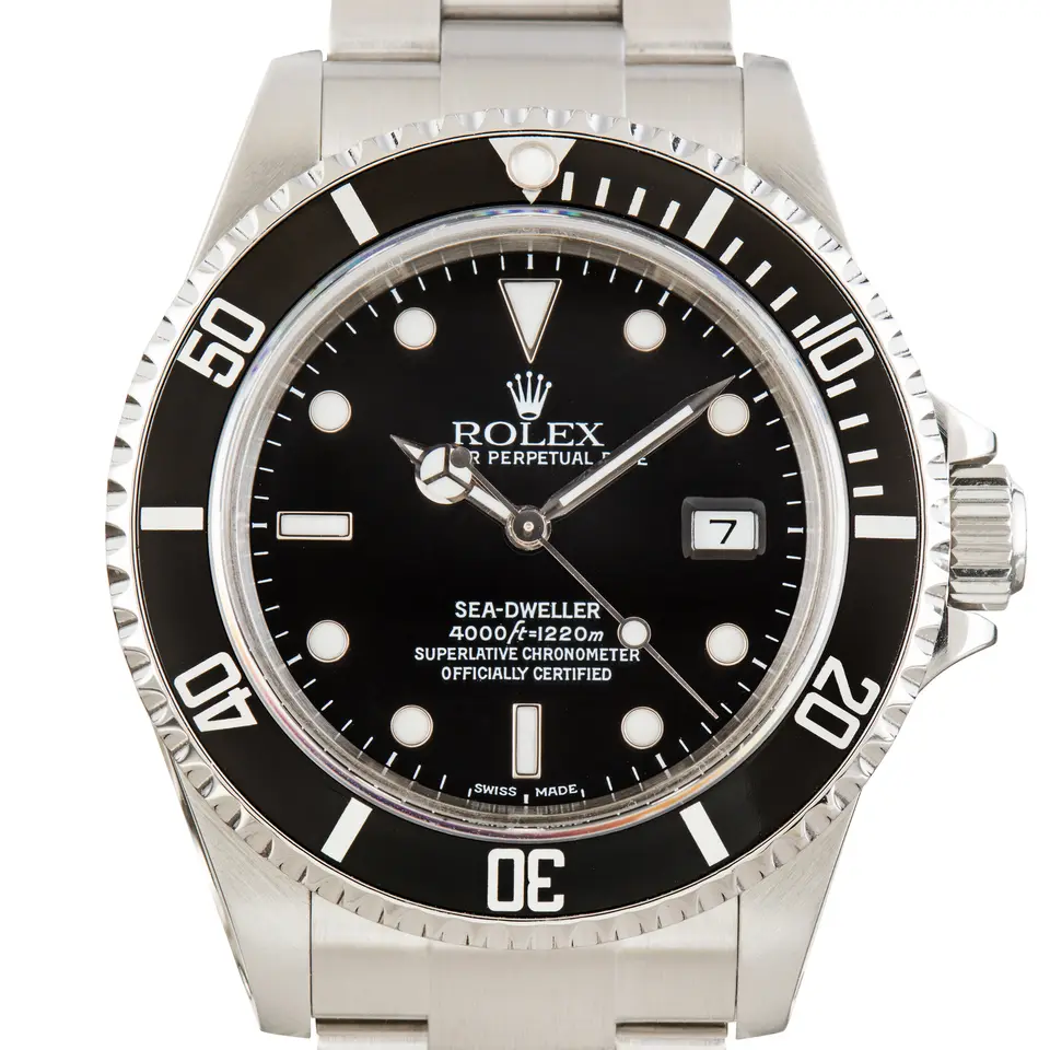 Rolex Sea-Dweller 4000 16600 with a black dial and black aluminium bezel insert on a steel Oyster bracelet, a pre-owned example, studio close-up of the case
