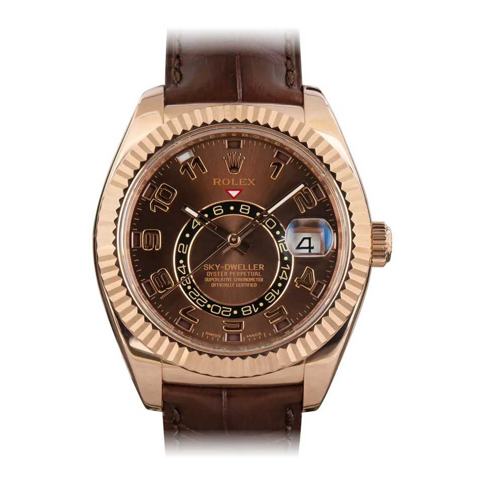 Rolex Sky-Dweller 326135 with a chocolate dial with Arabic numerals and fluted Everose bezel in Everose gold on a brown leather strap, a pre-owned example, front view of the whole watch