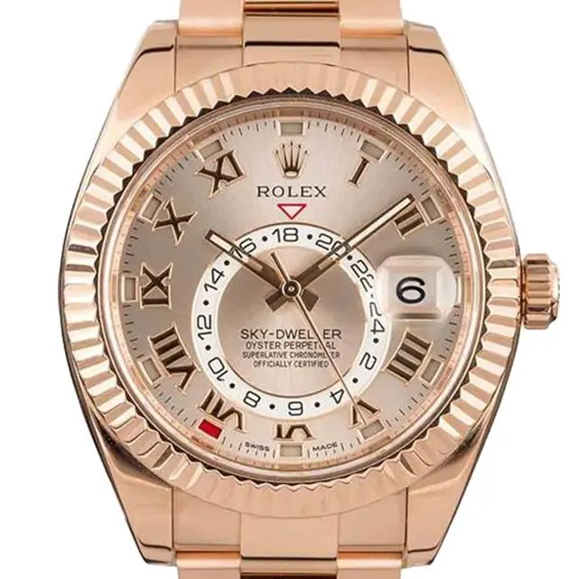 Rolex Sky-Dweller 326935 with a sundust dial with Roman numerals and fluted Everose bezel in Everose gold on an Oyster bracelet, a pre-owned example, studio close-up of the case