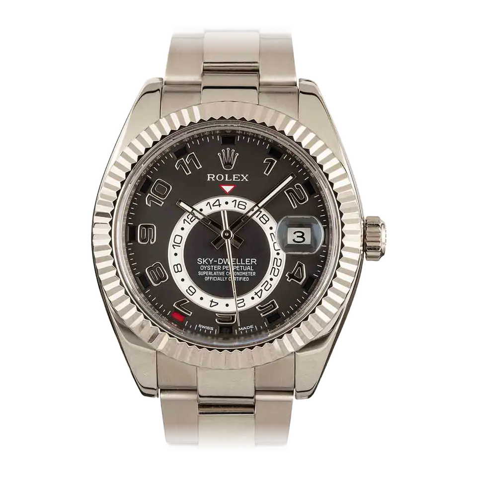 Rolex Sky-Dweller 326939 with a black dial with Arabic numerals, annual-calendar apertures and a fluted white gold bezel on a white gold Oyster bracelet, a pre-owned example, front view of the whole watch