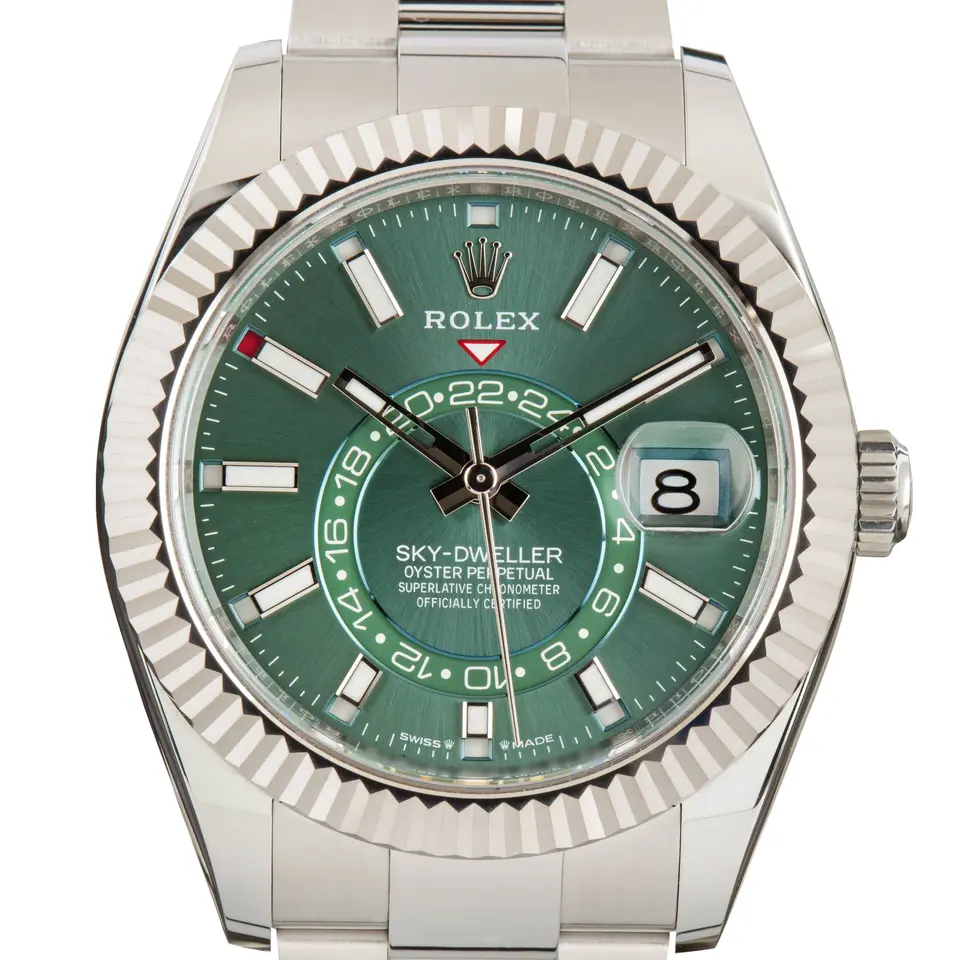 Rolex Sky-Dweller 336934 with a mint green dial and a fluted white gold bezel, a pre-owned example, studio close-up of the case