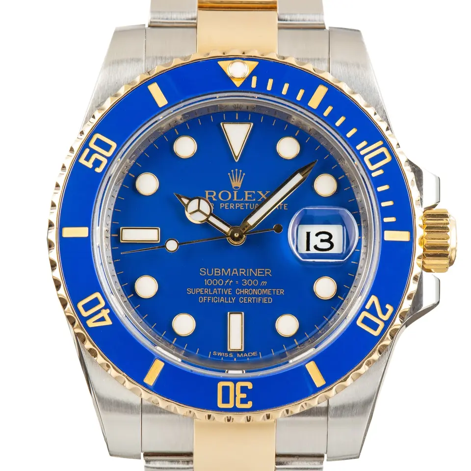 Rolex Submariner Date 116613LB with a blue dial and blue ceramic bezel in steel and yellow gold on an Oyster bracelet, a pre-owned example, studio close-up of the case
