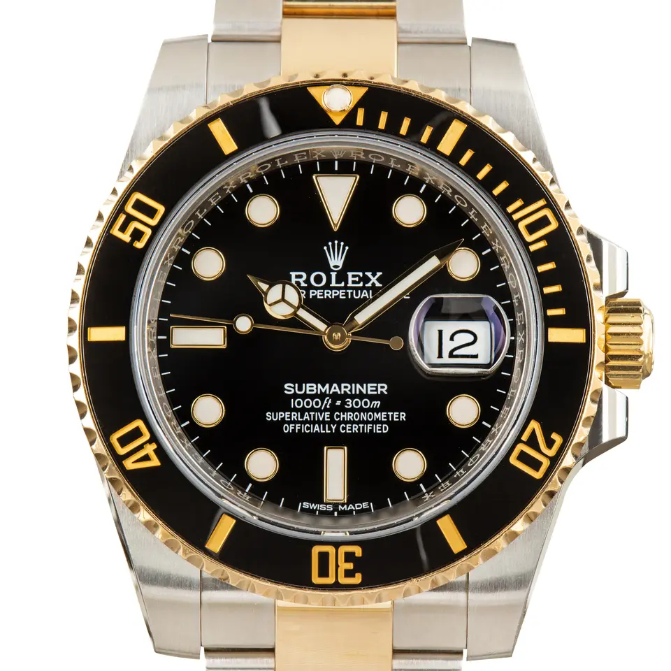 Rolex Submariner Date 116613LN with a black dial and black ceramic bezel in steel and yellow gold on an Oyster bracelet, a pre-owned example, studio close-up of the case