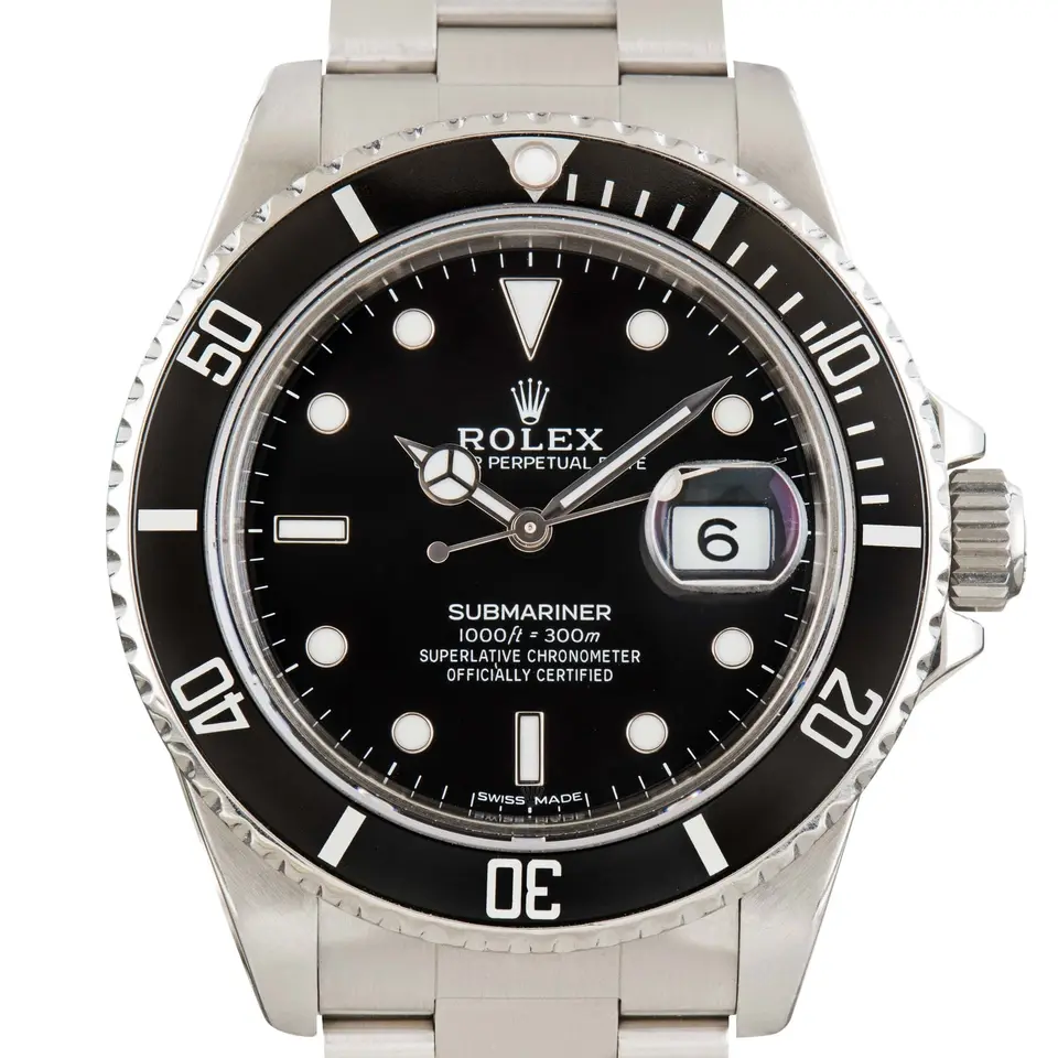 Rolex Submariner Date 16800 with a black dial, date window and black aluminium bezel insert on a steel Oyster bracelet, a pre-owned example, studio close-up of the case