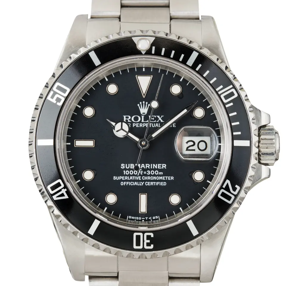 Rolex Submariner Date 168000 with a black dial, date window and black aluminium bezel insert on a steel Oyster bracelet, a pre-owned example, studio close-up of the case