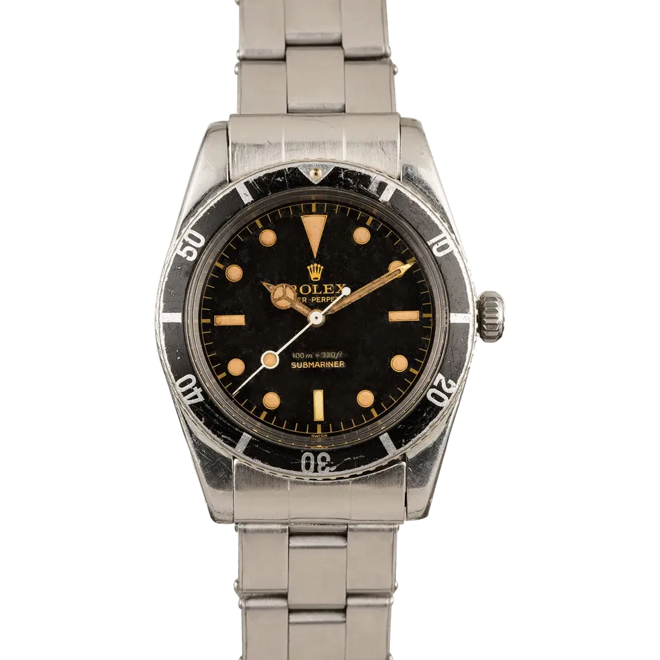 Rolex Submariner 6536 with a black gilt dial and aged black bezel insert on a steel bracelet, a pre-owned example, front view of the whole watch