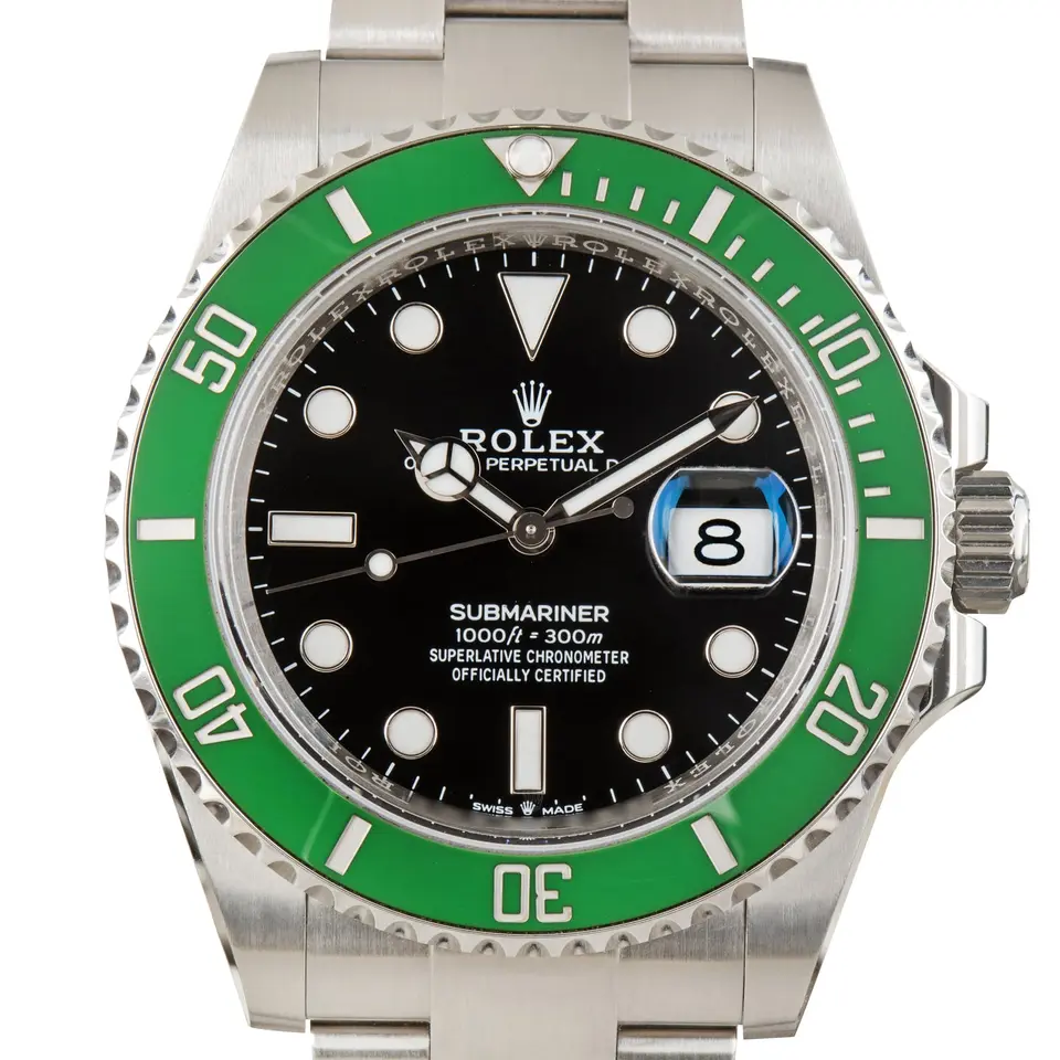 Rolex Submariner Date 126610LV with a black dial and green ceramic bezel, a pre-owned example, studio close-up of the case