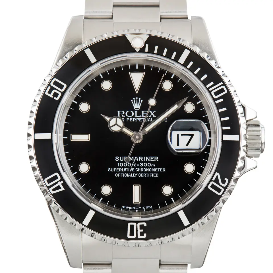 Rolex Submariner Date 16610 with a black dial, black aluminium bezel insert and date window on a steel Oyster bracelet, a pre-owned example, studio close-up of the case