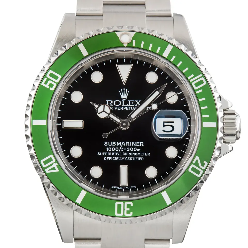 Rolex Submariner Date 16610LV with a black dial and green aluminium bezel insert on a steel Oyster bracelet, a pre-owned example, studio close-up of the case