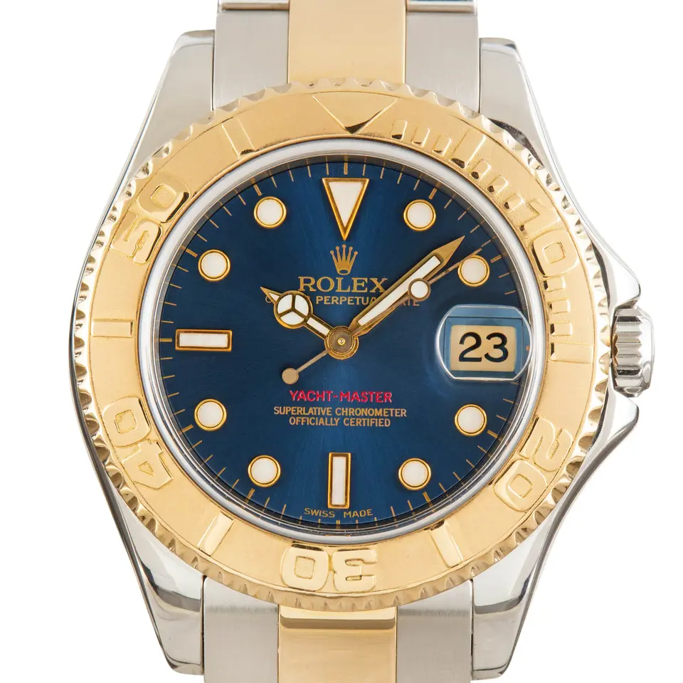 Rolex Yacht-Master 168623 with a blue dial and yellow gold bezel in steel and yellow gold on an Oyster bracelet, a pre-owned example, studio close-up of the case