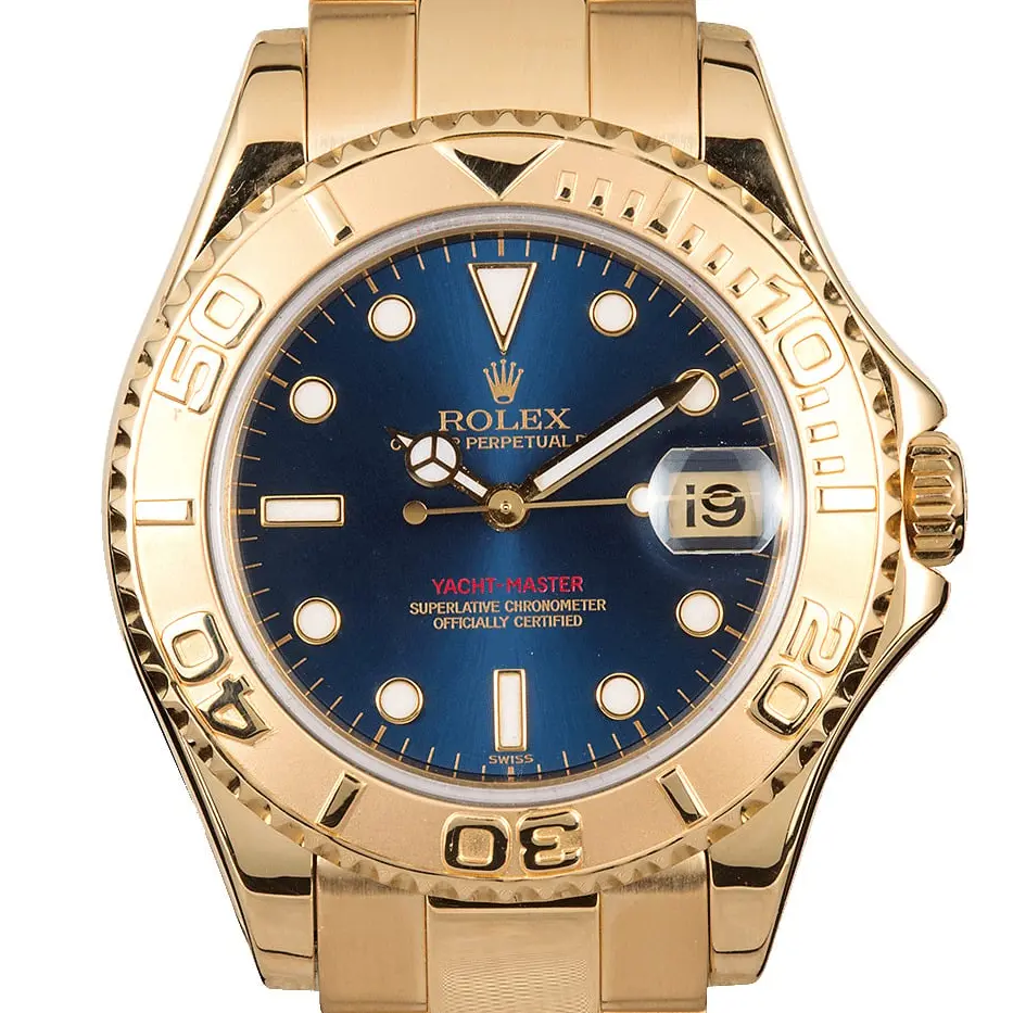 Rolex Yacht-Master 35 168628 with a blue dial, yellow gold rotating bezel and yellow gold Oyster bracelet, a pre-owned example, studio close-up of the case