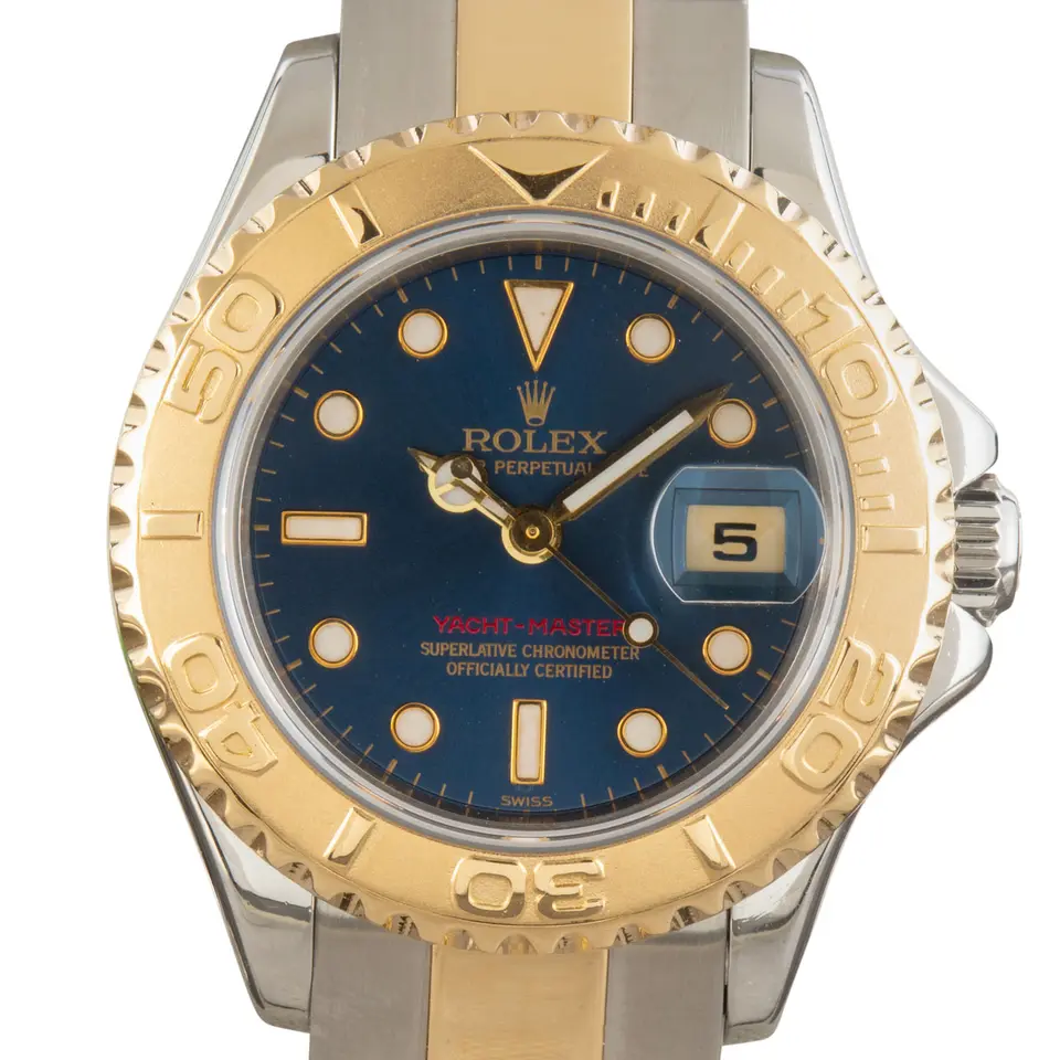 Rolex Yacht-Master 169623 with a blue dial, yellow gold rotating bezel and steel and gold Oyster bracelet, a pre-owned example, studio close-up of the case