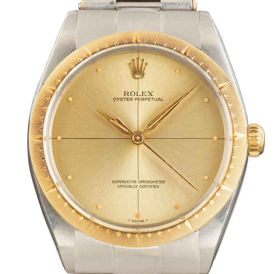 Rolex Oyster Perpetual Zephyr 1008 with a gold dial with cross-hair lines, engine-turned yellow gold bezel and steel and gold Oyster bracelet, a pre-owned example, studio close-up of the case