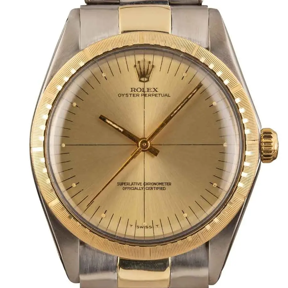 Rolex Zephyr 1038 with a champagne dial with cross-hair lines, engine-turned yellow gold bezel and steel and gold Oyster bracelet, a pre-owned example, studio close-up of the case