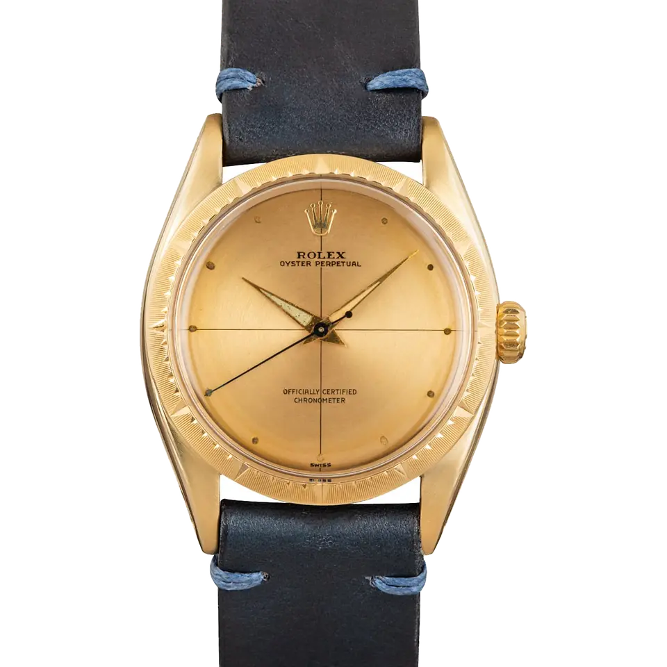 Rolex Zephyr 6582 with a gold dial with cross-hair lines, engine-turned yellow gold bezel and gold case on a navy leather strap, a pre-owned example, front view of the whole watch
